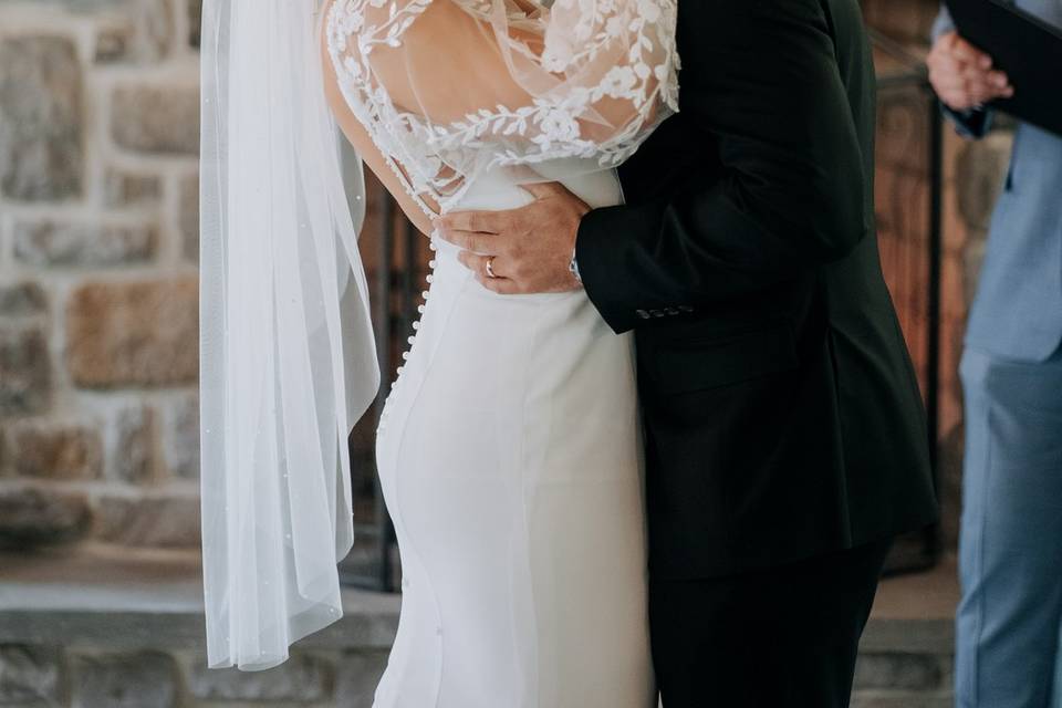 Bride and groom first kiss