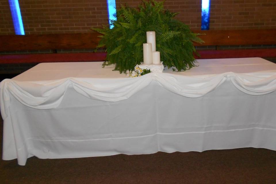 Table with candle and plant