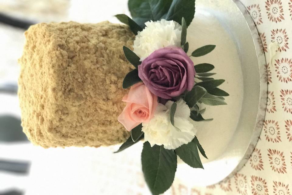 Pretty little cake with cookie crumb texture on top tier.  Forgive the tilted pic.