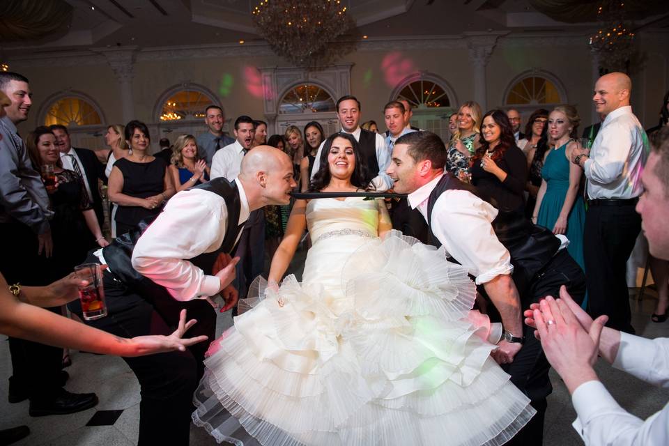 Bride and bridal party dancing