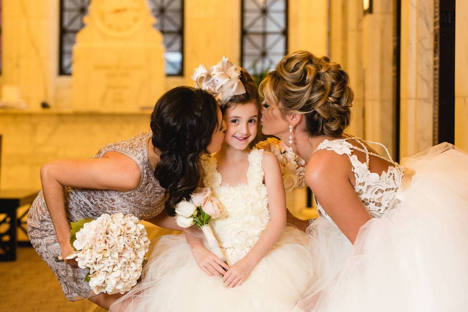 Bride with her flower girl and bridesmaid