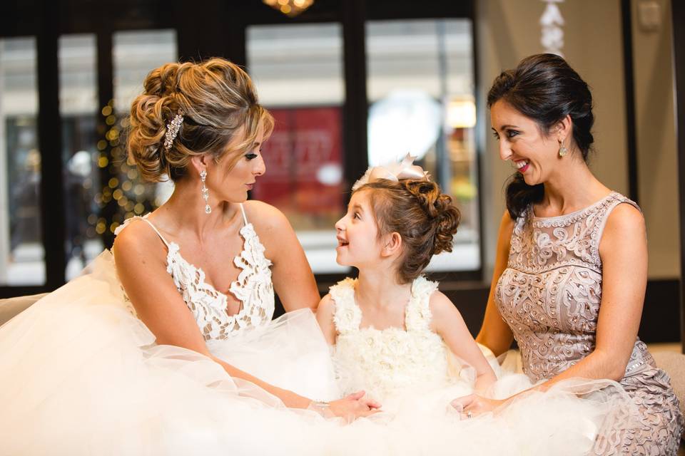 Bride with her flower girl and bridesmaid