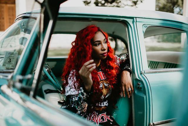 Red hair and blue car