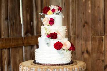 Four tier cake with pink and red roses