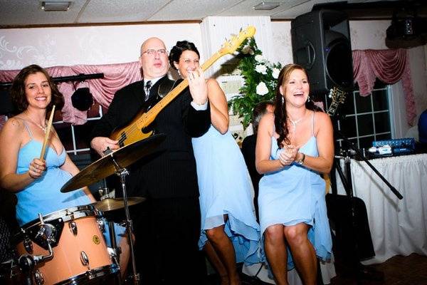 Cipriano Productions playing music together with the bridesmaids.