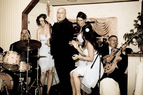 Cipriano Productions playing music together with the bridesmaids.