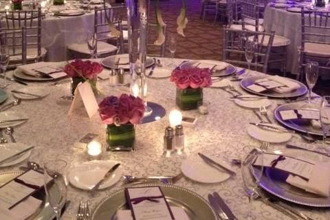 Table setup with tall flower arrangements