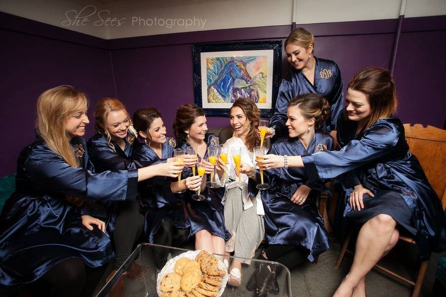 Bridal party toast in their robes