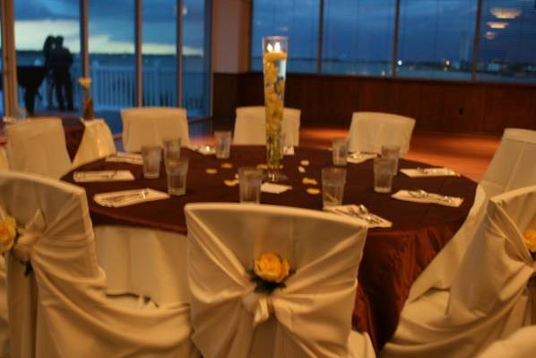 Ivory tie-back chair covers with chocolate brown satin overlays