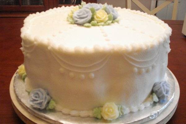 Shannon and Zach Robinson wedding cake at the Hilton Garden Inn in Fairfax, VA on 5/12/2010.  3-tier square and round wedding cake, chocolate, lemon w/raspberry filling w/purple flowers.  Served 154.