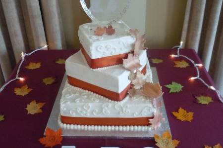 Karla and Mario's Wedding CakeWaterford at Springfield, VA3-tier w/fuscia pink ribbonYellow, Almond and Carrot cake with buttercream