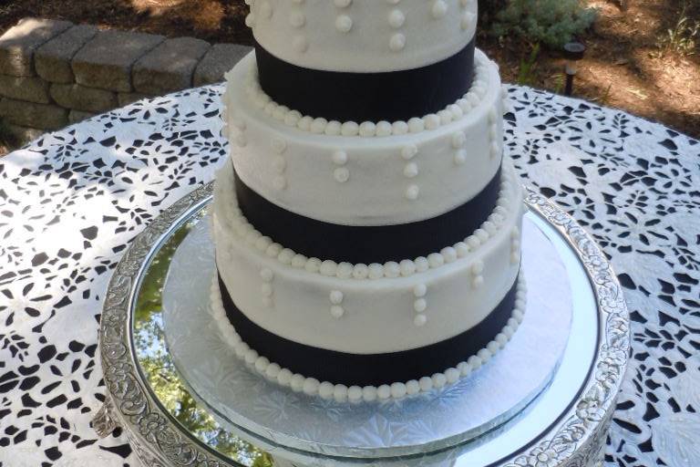 3-Tier Wedding Cake w/black ribbonCarrot Cake, Vanilla Bean and Red Velvet