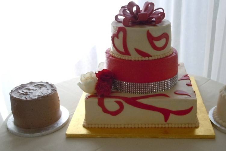 Wedding Cake at Bristow Manor on 6/22/133-Tier, Square and Round with Fondant designs and bow2 Side Specialty Cakes