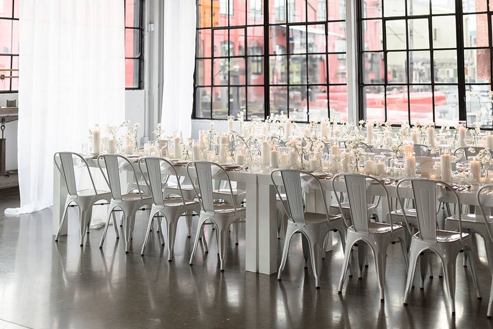 White reception tables and chairs