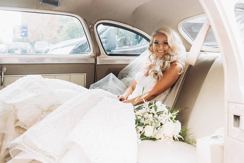 Bride sitting in car