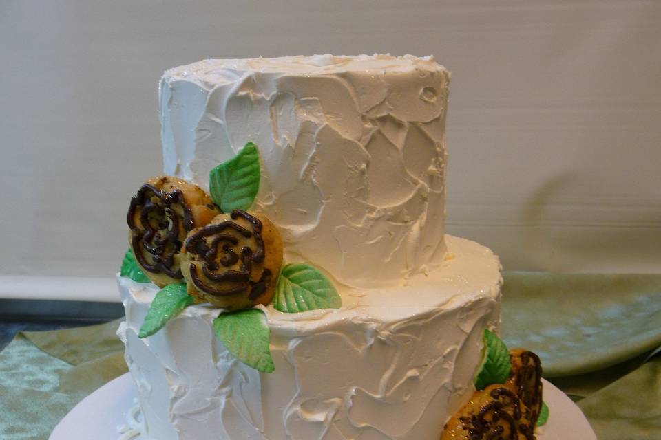 100% buttercream iced with mini cookies for flowers