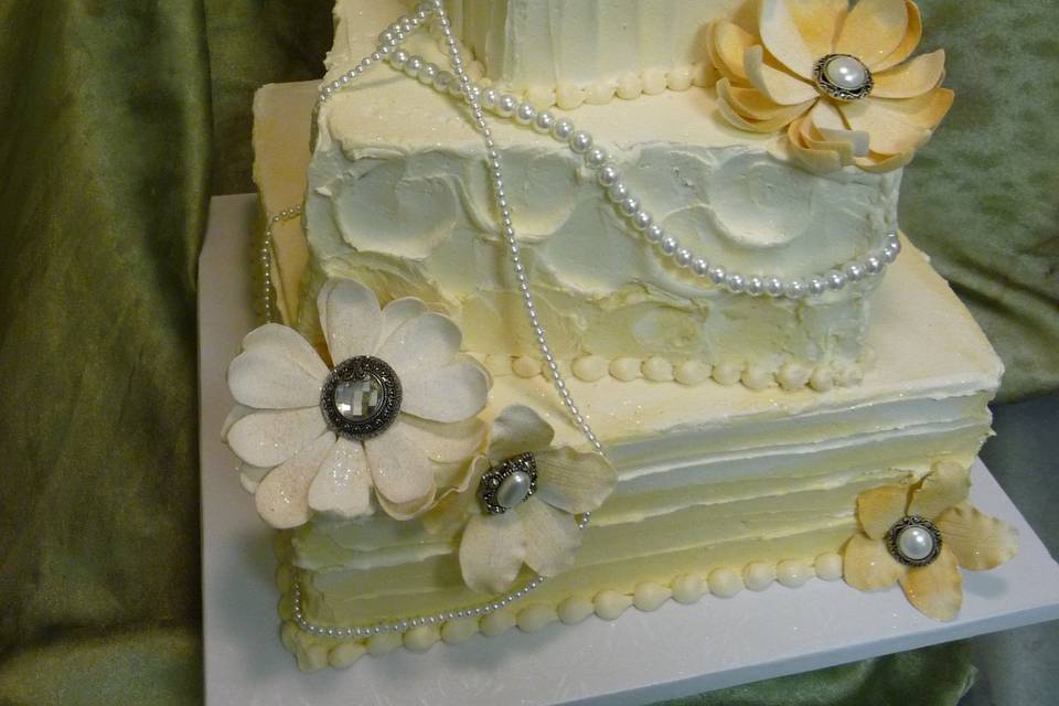 100% buttercream iced with fondant flowers