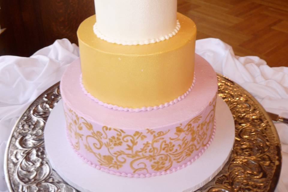 100% fondant iced and stenciled with gold paint