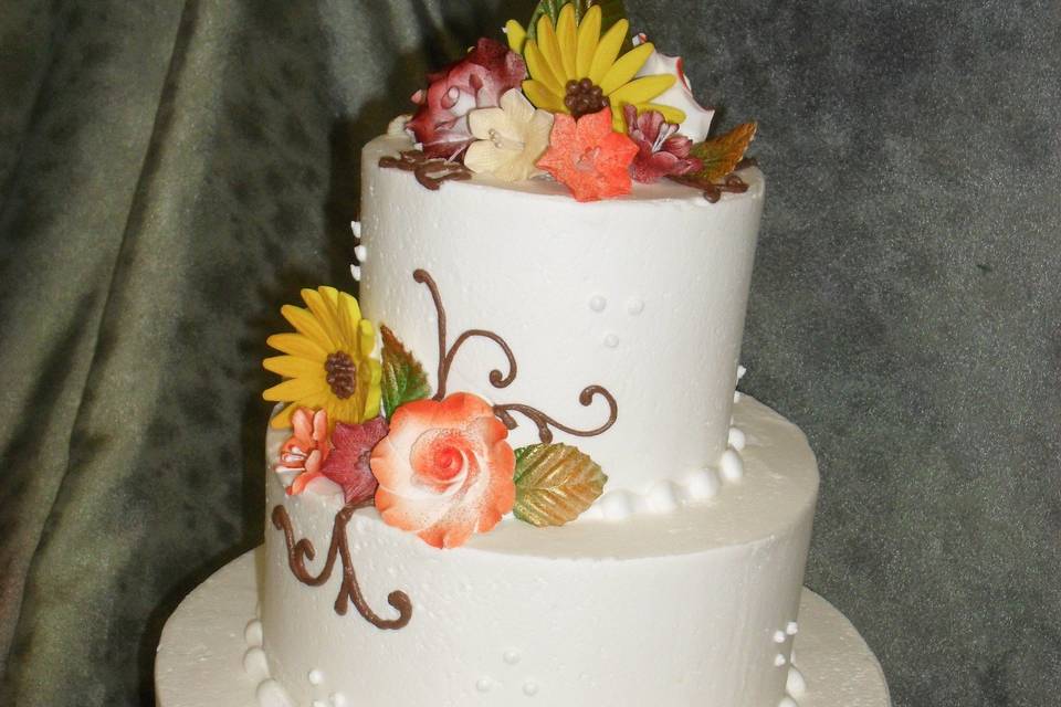 100% buttercream iced with fondant flowers