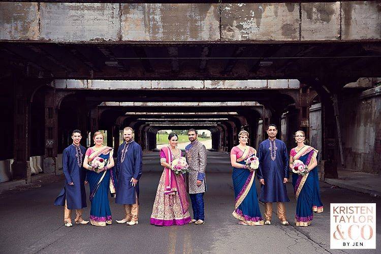 The newlyweds with the wedding attendants