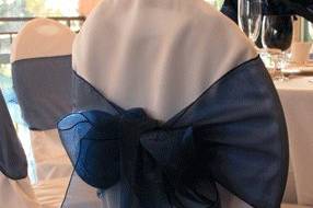 White chair cover with Navy Blue organza bow.