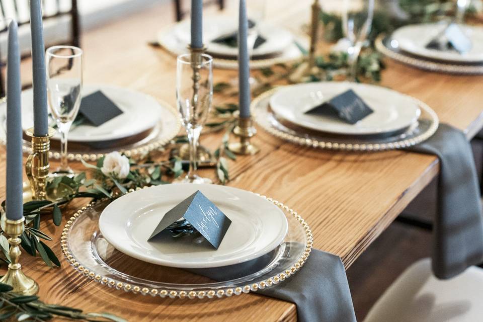 Brass candlesticks and colored tapers are the perfect table top decor