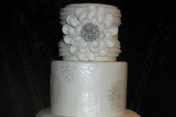 Fondant finish with pealized silver stenciling and stylized focal flowers.