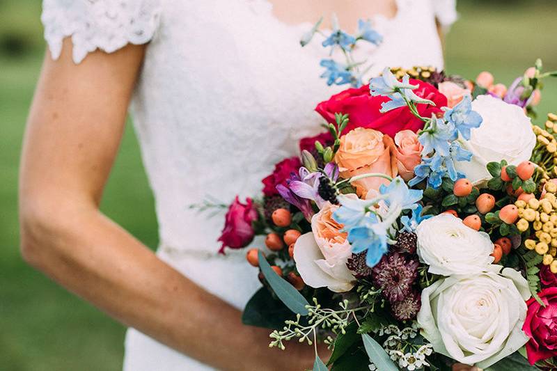 Off-shoulder dress and bouquet | Jared Ladia Photography