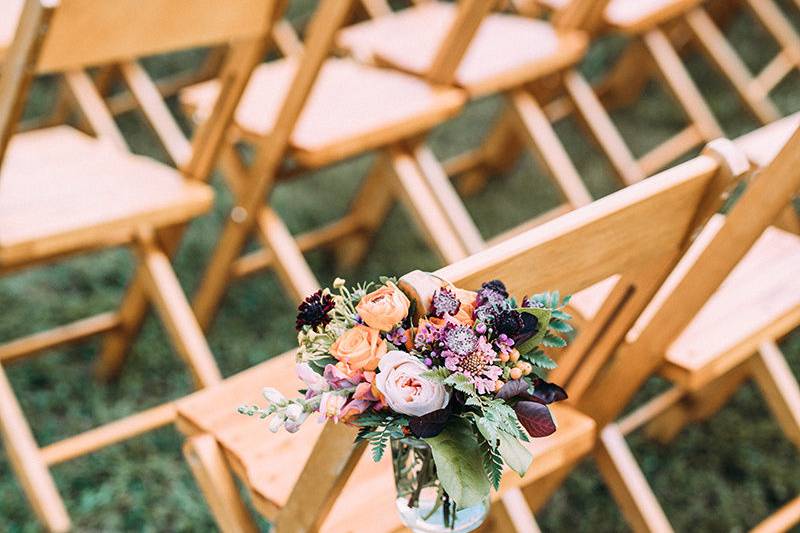 Floral chair decor | Jared Ladia Photography