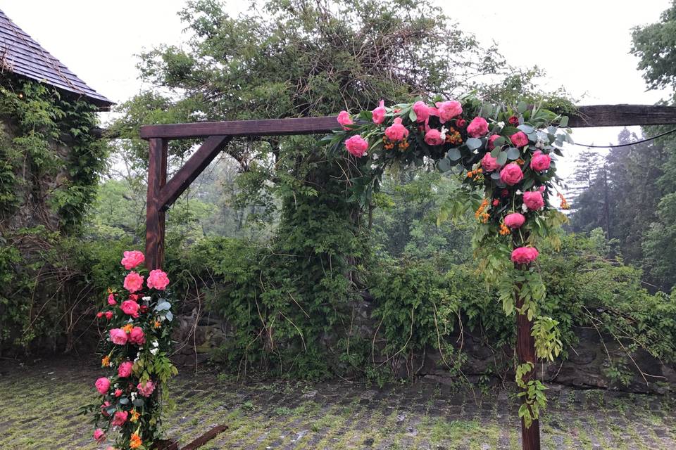 Big coral peonies for an arch at the Cobblestone Courtyard at Lauxmont