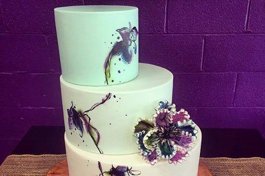 White wedding cake with minimal floral design