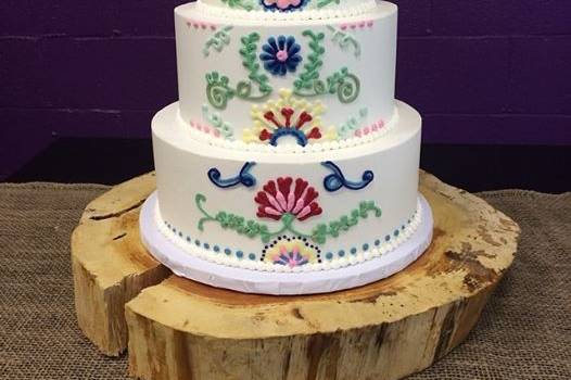 White wedding cake with colorful patterns