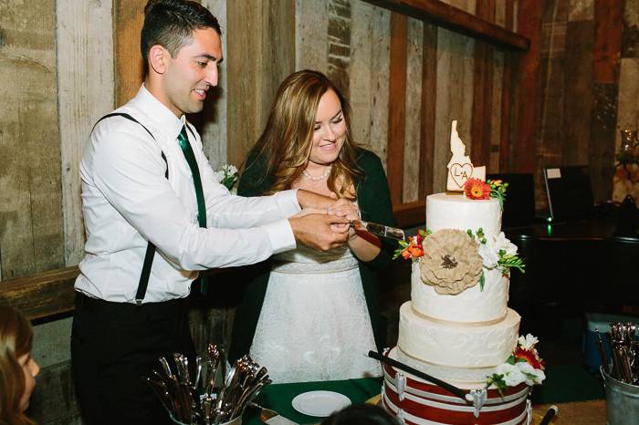 Newlyweds slicing the cake