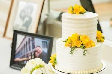 White wedding cake with yellow flowers