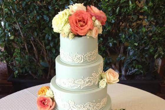 Baby blue wedding cake with flowers