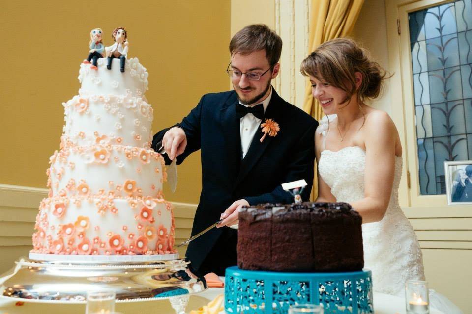 Newlyweds cutting the cake