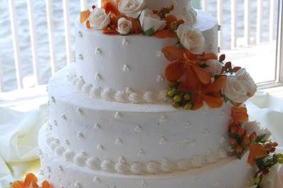 Sunset orchids, roses to decorate the cake.