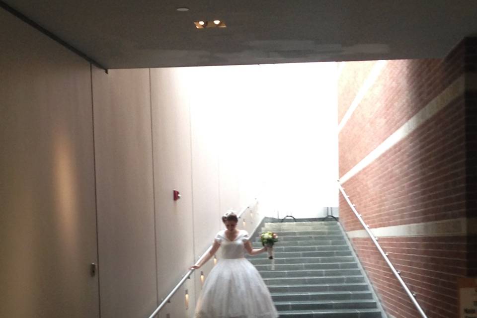 Bride goes down the stairs