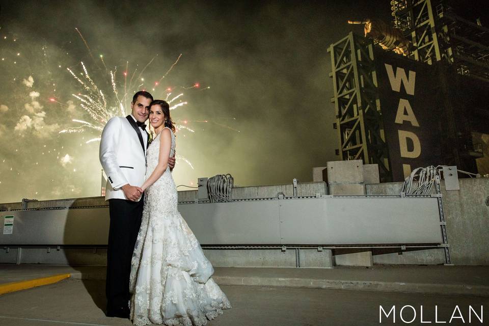 Fireworks behind the beautiful couple