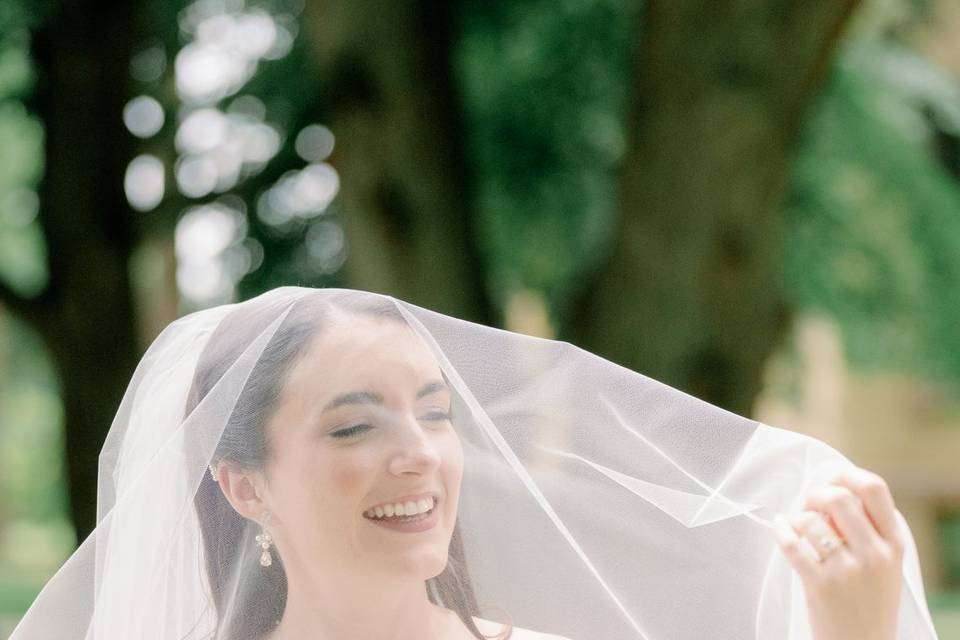 Bride loving her veil