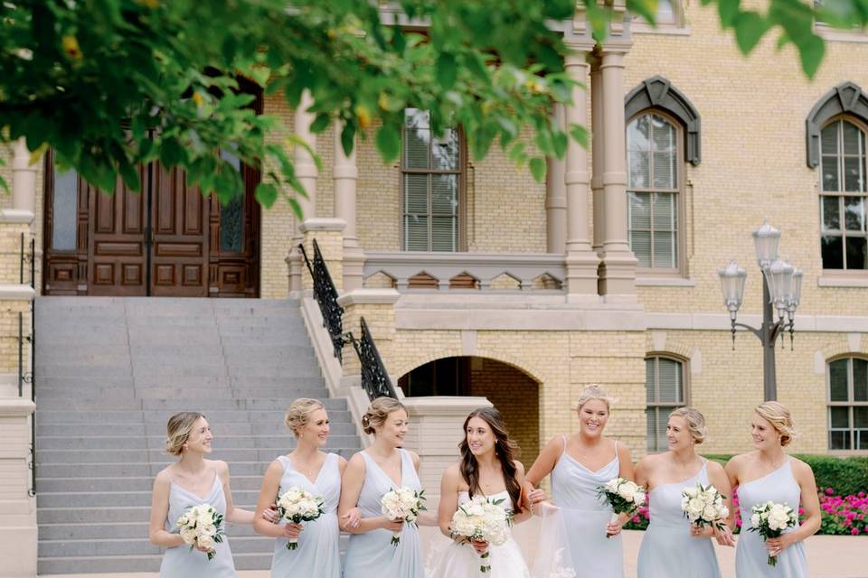 Bridesmaids walking on campus