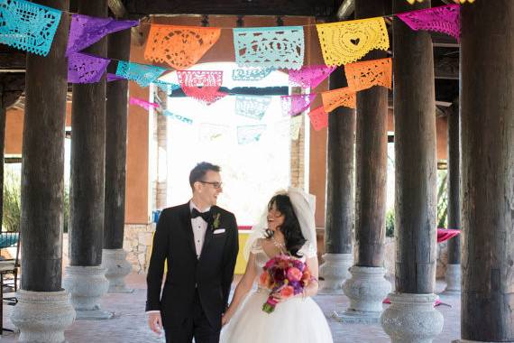 There's nothing more beautiful than hand cut papel picado tissue paper banners for your fiesta wedding! It adds such an elegance and whimsy at the same time creating a romantic setting for the bride and groom. Each banner includes 10 tissue paper flags per strand (18