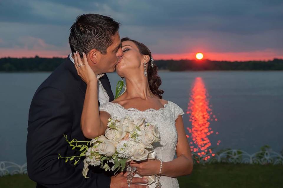 Sunset wedding kiss