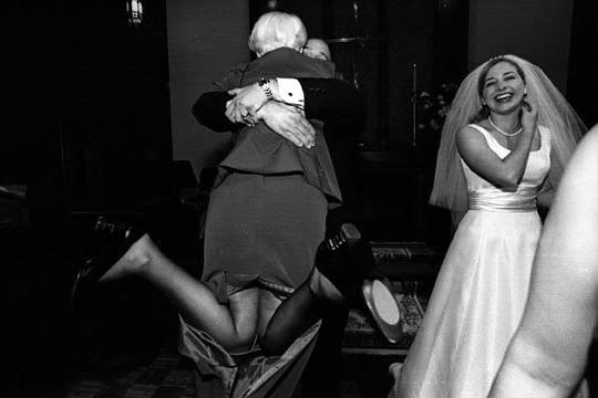 I love this shot. Mom hugs her son after he just got married.  Funny too.