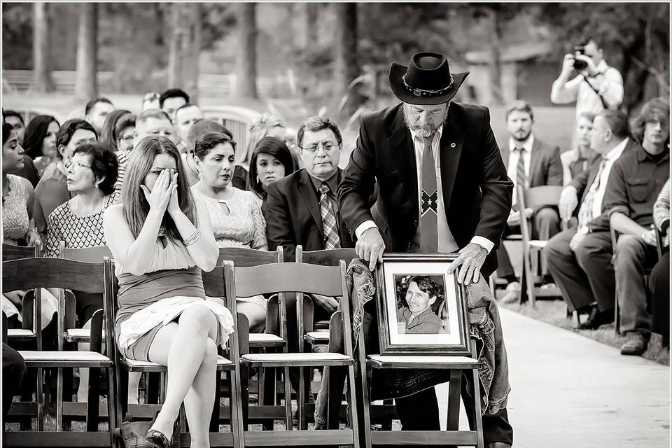 This was one of the most bittersweet moments I have ever witnessed. They had a memory chair in honor of the groom's father, who had passed away. His sister became very emotional when his photograph and image were delivered to the memory chair.