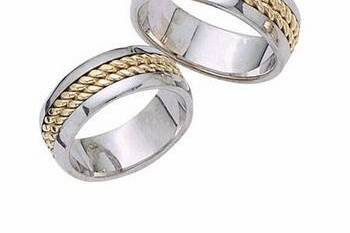 This amazingly crafted 14k two tone gold, his and hers wedding band is designed to have a smooth and silky interior for a comfort fit wearability.  The bands have an elegant look with its white gold high polish finish among yellow gold braided design.