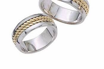 This contemporary 14k two-tone his and hers band has a white gold center and yellow gold outer edges with high polish finish and bright cuts. Comfort Fit and Available in any size and width.