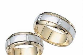 This contemporary 14k two-tone his and hers band has a white gold center and yellow gold outer edges with high polish finish and bright cuts. Comfort Fit and Available in any size and width.