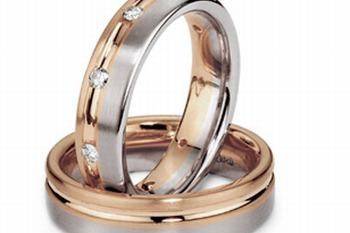 This amazingly crafted 14k two tone gold, his and hers wedding band is designed to have a smooth and silky interior for a comfort fit wearability.  The bands have an elegant look with its white gold high polish finish among yellow gold braided design.