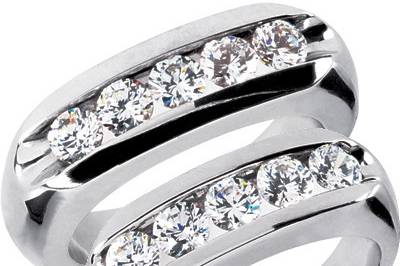 This exquisitely designed Diamond Wedding Bands Set includes two beautiful rings made of 14k white gold along with stunning hand-picked diamonds. Each ring is set with five round cut brilliants weighing a total of approximately 1.25 ct on the mens ring and with approximately 1.00 ct on the women's band with a silky smooth comfort fit interior.